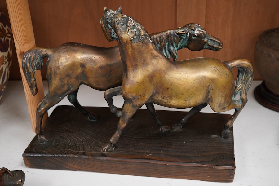 A Romanian bronze of two horses, 45cm wide